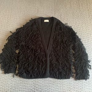 Very cute black frilly Cardigan.